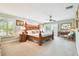 Serene main bedroom retreat with large windows, shutter blinds, and decorative woodwork at 4106 Queller Way, Tampa, FL 33618