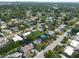 A bird's eye view of a neighborhood showcasing the proximity of homes and tree coverage at 4111 W Marietta St, Tampa, FL 33616