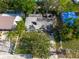 Aerial view showing a severely damaged home with roof damage at 4111 W Marietta St, Tampa, FL 33616