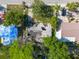 Close-up aerial view reveals extensive damage to a home, now with a collapsing structure at 4111 W Marietta St, Tampa, FL 33616