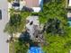 Birds-eye view of a damaged house showing fire damage to the roof and structure at 4111 W Marietta St, Tampa, FL 33616
