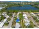 A landscape aerial highlighting the neighborhood's houses and nearby lake at 4111 W Marietta St, Tampa, FL 33616