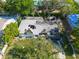 Detailed aerial view of the severe fire damage and structural collapse of a residential home at 4111 W Marietta St, Tampa, FL 33616