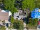 Aerial view of a damaged house with a collapsed roof and debris in the yard at 4111 W Marietta St, Tampa, FL 33616