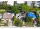 Aerial view of severely damaged home with surrounding properties at 4111 W Marietta St, Tampa, FL 33616