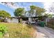 View of a fire-damaged home showing charred remnants at 4111 W Marietta St, Tampa, FL 33616