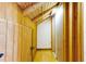 Attic featuring wood floors, and exposed wood beam ceiling with a door leading to the exterior at 4801 Lynn Oaks Cir, Dover, FL 33527