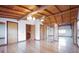 Bedroom featuring wood floors, exposed wood beam ceiling, chandelier, and multiple closets at 4801 Lynn Oaks Cir, Dover, FL 33527