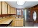 Charming kitchen with wood cabinets, stainless steel appliances, and laminate countertops for a rustic feel at 4801 Lynn Oaks Cir, Dover, FL 33527