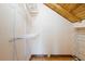 Walk-in closet featuring wood floors, shelving, and exposed wood beam ceiling at 4801 Lynn Oaks Cir, Dover, FL 33527