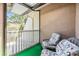 Cozy balcony featuring two chairs and a view of the lush surroundings and serene views at 486 Lakeview Dr # 54, Palm Harbor, FL 34683
