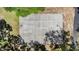 Aerial view of a concrete basketball court surrounded by lush trees and a pathway at 486 Lakeview Dr # 54, Palm Harbor, FL 34683