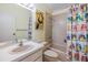 Bathroom with a white vanity, a large mirror, and a shower-tub combo at 486 Lakeview Dr # 54, Palm Harbor, FL 34683