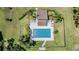 Aerial view of a private community pool surrounded by lush landscaping, offering a tranquil and luxurious retreat at 486 Lakeview Dr # 54, Palm Harbor, FL 34683