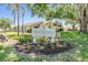 Welcome to The Townhomes of Westlake Village, with its beautifully landscaped sign enhancing the community's charm at 486 Lakeview Dr # 54, Palm Harbor, FL 34683