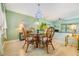 Charming dining room featuring a glass-top table and wicker chairs at 486 Lakeview Dr # 54, Palm Harbor, FL 34683