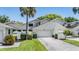 Well-maintained two-story home with a two-car garage and lush landscaping at 486 Lakeview Dr # 54, Palm Harbor, FL 34683