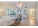 Tranquil main bedroom features bay windows, light wood floors, and neutral decor at 486 Lakeview Dr # 54, Palm Harbor, FL 34683