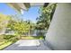 A serene water view from the property shows the building's facade and surrounding greenery at 486 Lakeview Dr # 54, Palm Harbor, FL 34683