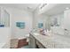 This bathroom features a granite countertop vanity, shower, and soaking tub at 5302 Aloha Seed Dr, Seffner, FL 33584