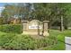 Attractive community sign with stone accents and lush landscaping at 5302 Aloha Seed Dr, Seffner, FL 33584