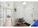 Inviting entryway with wood floors and coat rack with shoe storage at 5302 Aloha Seed Dr, Seffner, FL 33584
