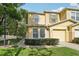 Charming two-story townhome with landscaped front yard and attached one car garage at 5302 Aloha Seed Dr, Seffner, FL 33584