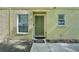 View of the front door of the home, with a welcome mat at 5302 Aloha Seed Dr, Seffner, FL 33584