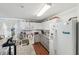 Bright kitchen with white cabinets, stainless steel appliances, granite countertops, and a stainless steel sink at 5302 Aloha Seed Dr, Seffner, FL 33584
