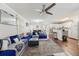 Spacious living room with hardwood floors that opens to the kitchen at 5302 Aloha Seed Dr, Seffner, FL 33584