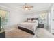 A comfortably decorated main bedroom features a ceiling fan and natural light at 5302 Aloha Seed Dr, Seffner, FL 33584