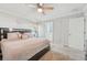 The primary bedroom boasts a ceiling fan and ensuite bathroom access at 5302 Aloha Seed Dr, Seffner, FL 33584
