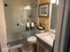 A renovated bathroom boasts a glass-enclosed shower, modern fixtures and tasteful décor at 6190 80Th N St # 204, St Petersburg, FL 33709