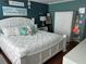 Charming bedroom featuring a plush white bed with decorative pillows and stylish furnishings at 6190 80Th N St # 204, St Petersburg, FL 33709
