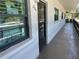 Main front entrance to the unit with views of Easter decorations and exterior corridor at 6190 80Th N St # 204, St Petersburg, FL 33709