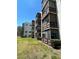 Exterior condo shot with screen porches and landscaping creating curb appeal at 6190 80Th N St # 204, St Petersburg, FL 33709