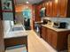 Well-lit kitchen featuring updated appliances, granite countertops, and a breakfast bar with seating at 6190 80Th N St # 204, St Petersburg, FL 33709