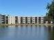 Building overlooks a beautiful lake adding serenity to the property's landscape at 6190 80Th N St # 204, St Petersburg, FL 33709