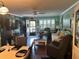 Comfortable living area with hardwood flooring, ample seating, and charming decor with lots of natural light at 6190 80Th N St # 204, St Petersburg, FL 33709