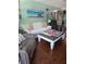 Living room features a comfortable white couch and recliner, perfect for relaxing or entertaining guests at 6190 80Th N St # 204, St Petersburg, FL 33709