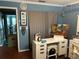 Bright office space with hardwood floors, ample counter space, and open doorway with extra art supplies ready for use at 6190 80Th N St # 204, St Petersburg, FL 33709