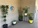 Inviting patio adorned with potted plants and a decorative sun, creating a cozy outdoor space at 6190 80Th N St # 204, St Petersburg, FL 33709