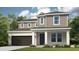 Charming two-story home featuring a covered porch, attached two-car garage, and manicured lawn at 813 Steel Dr, Apollo Beach, FL 33572