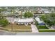 Aerial view of home showcasing the neighborhood and waterfront views at 8721 Bay Crest Ln, Tampa, FL 33615