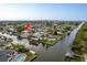 Waterfront property featuring a private pool and direct access to the navigable canal at 8721 Bay Crest Ln, Tampa, FL 33615
