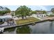 This waterfront home includes a spacious backyard, perfect for relaxing by the canal at 8721 Bay Crest Ln, Tampa, FL 33615
