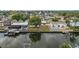 Beautiful waterfront property featuring a backyard with a pool and dock, ideal for boating at 8721 Bay Crest Ln, Tampa, FL 33615