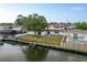 Picture of a home's backyard, showcasing the expansive lawn and waterfront access at 8721 Bay Crest Ln, Tampa, FL 33615