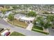 Aerial view of a home located on a canal with a spacious yard and neighborhood surroundings at 8721 Bay Crest Ln, Tampa, FL 33615