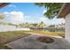 This backyard features a concrete patio and a beautiful waterfront view at 8721 Bay Crest Ln, Tampa, FL 33615